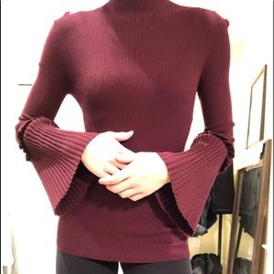 Maroon mock-turtle neck trumpet sleeve shirt